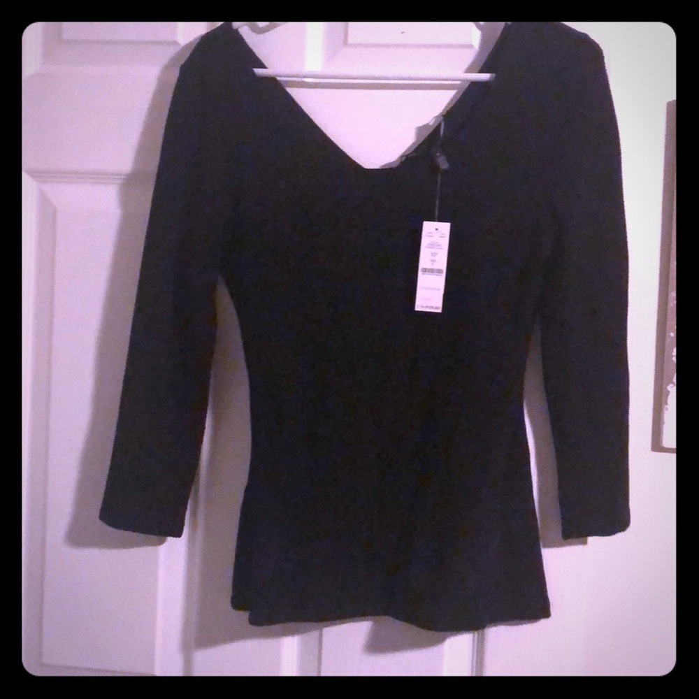 Black fitted shirt.